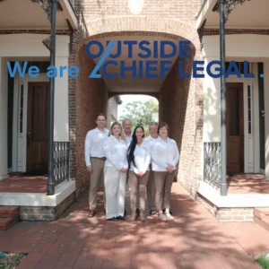 Group photo outside - we are outside chief legal