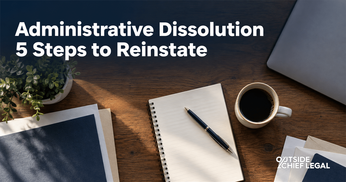 An overhead view of a business owner's desk while reviewing the steps to reinstate a company after administrative dissolution.
